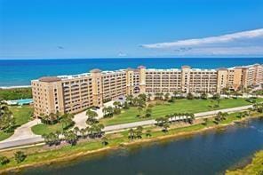 drone / aerial view with a water view