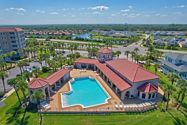 drone / aerial view with a residential view and a water view