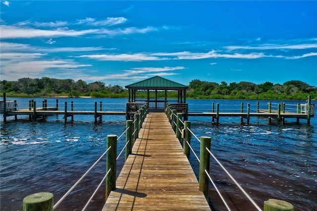 view of dock featuring a gazebo and a water view