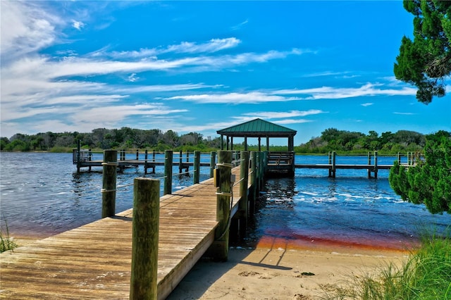 dock area with a gazebo and a water view