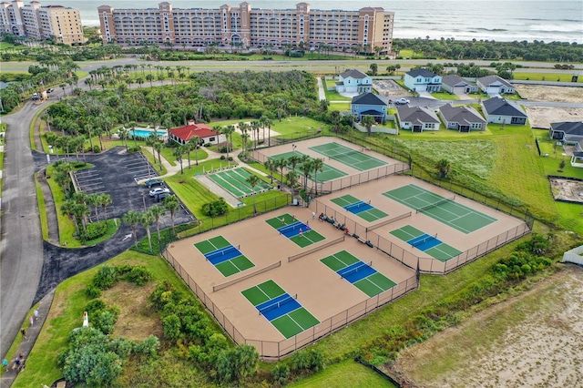 birds eye view of property featuring a view of city and a water view