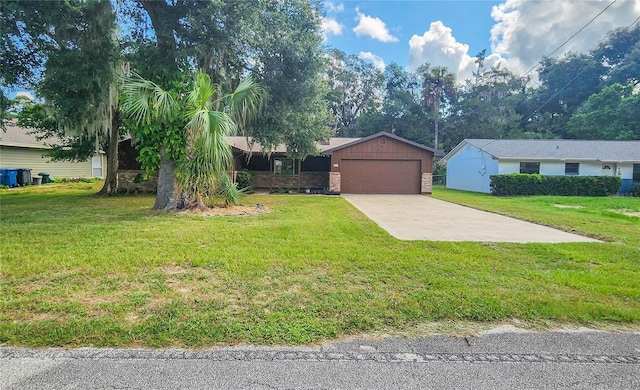 view of front of property featuring a front yard, a garage, brick siding, and driveway