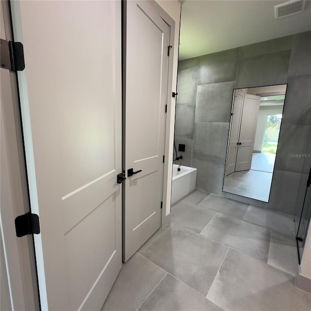 bathroom with tile patterned flooring