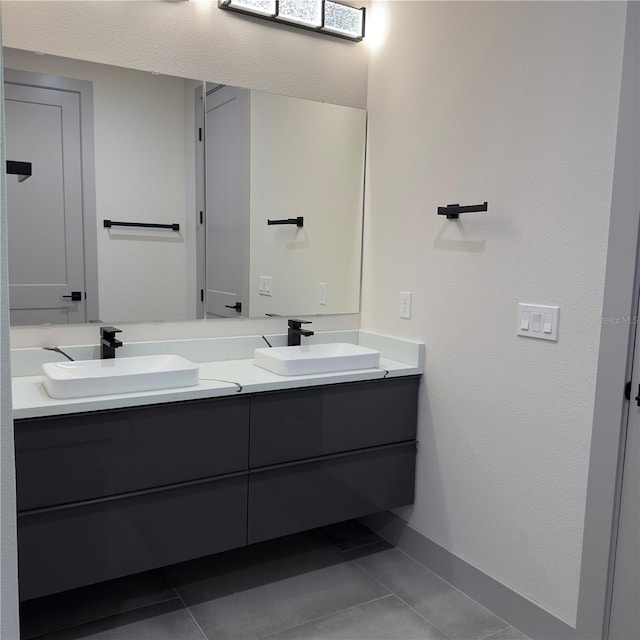 bathroom with tile patterned floors and double vanity