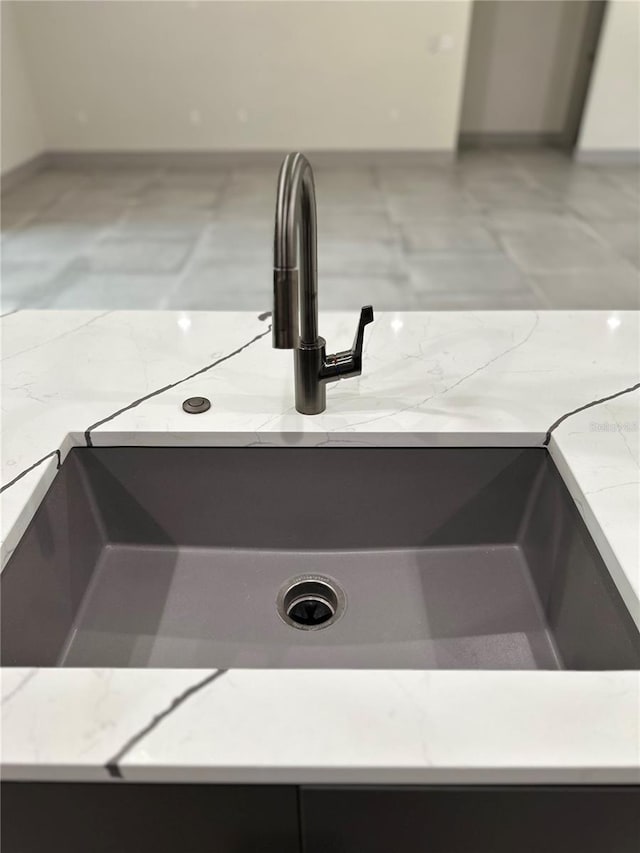 interior details with sink and tile patterned floors