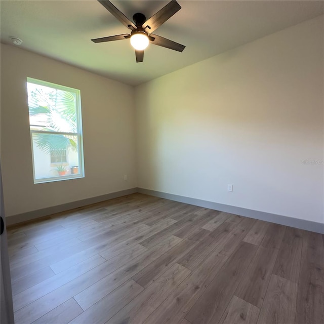 unfurnished room featuring ceiling fan and wood-type flooring