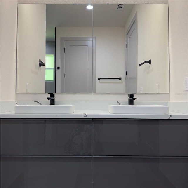 bathroom featuring dual bowl vanity