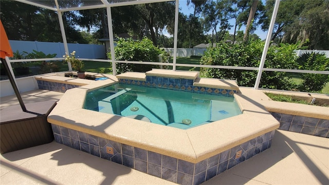 view of swimming pool with an in ground hot tub