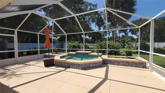 view of swimming pool with glass enclosure, an in ground hot tub, and a patio area