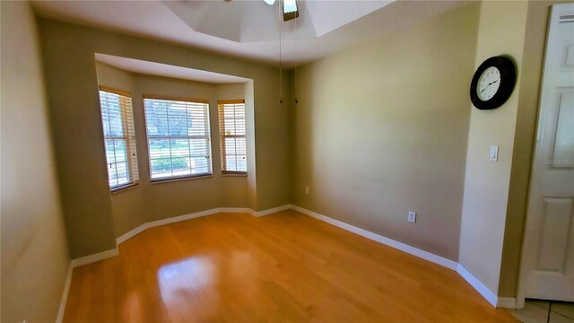 spare room featuring ceiling fan and light wood-type flooring