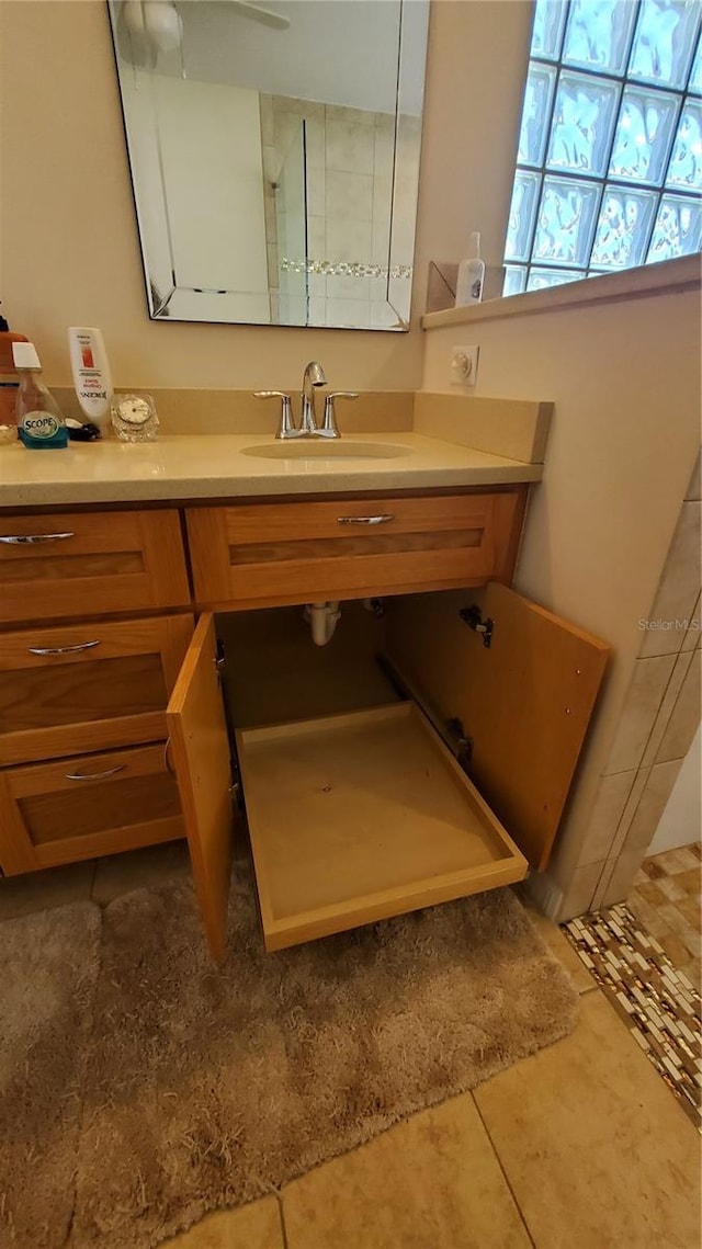 bathroom with tile patterned floors and vanity