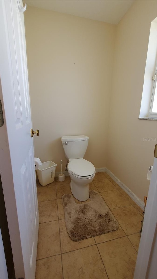 bathroom featuring tile patterned floors and toilet