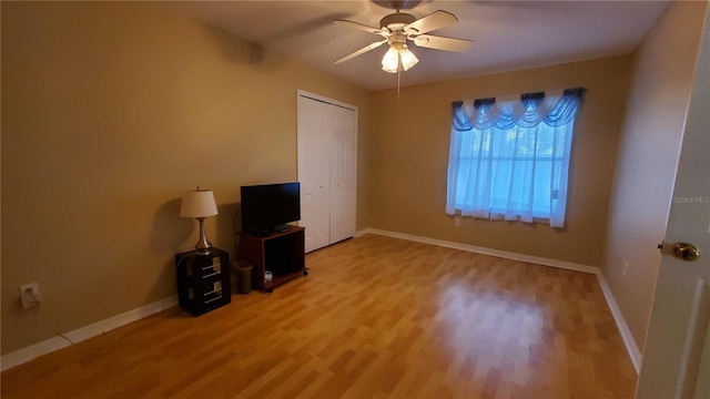 unfurnished living room featuring light wood-type flooring and ceiling fan