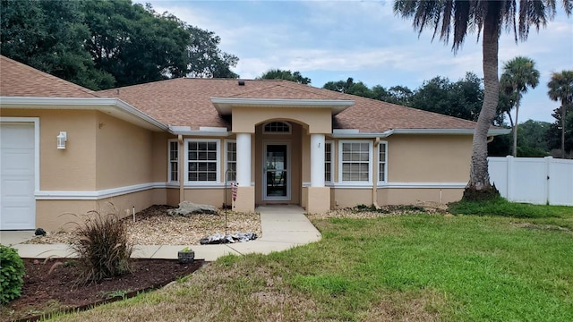 view of front of property with a front lawn