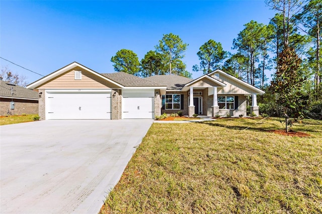 craftsman-style house featuring a front yard and a garage