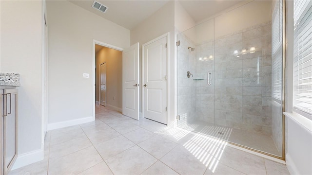 bathroom featuring tile patterned floors and walk in shower