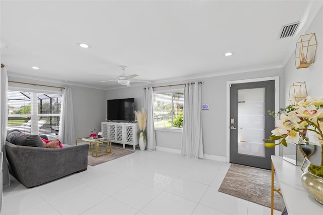 living area with ornamental molding, recessed lighting, visible vents, and baseboards