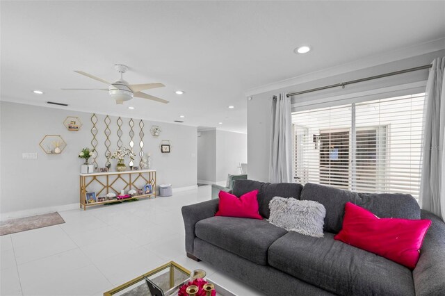 tiled living room featuring ceiling fan and ornamental molding