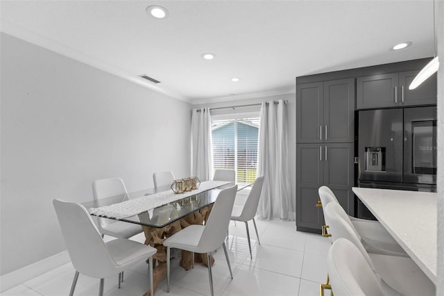 dining space featuring light tile patterned floors, recessed lighting, visible vents, and baseboards