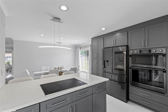 kitchen with pendant lighting, light tile patterned flooring, crown molding, and black appliances