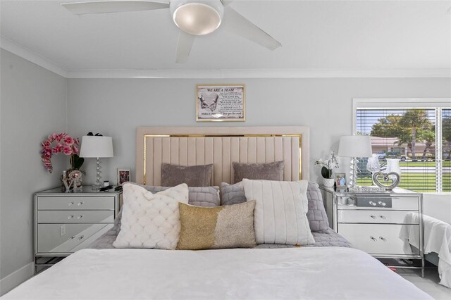 bedroom with ceiling fan and ornamental molding