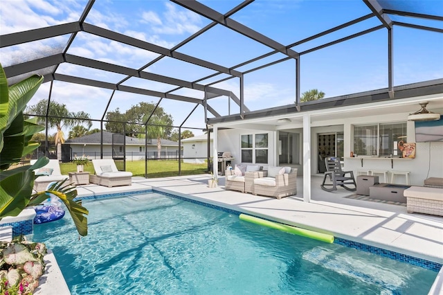 outdoor pool featuring a patio area, glass enclosure, a grill, and an outdoor hangout area