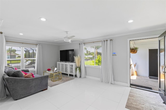 living room featuring ceiling fan and light tile patterned floors