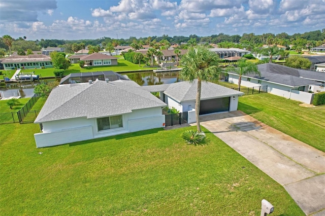 birds eye view of property featuring a water view and a residential view