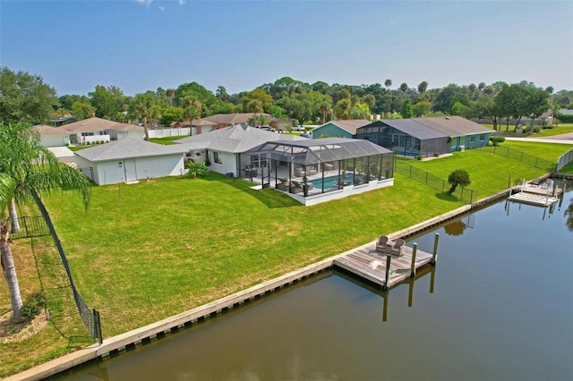 drone / aerial view with a water view and a residential view