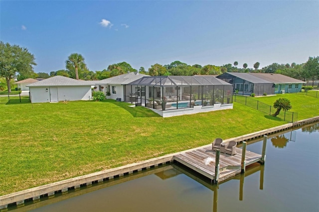 view of dock featuring glass enclosure, a water view, fence, a lawn, and a residential view