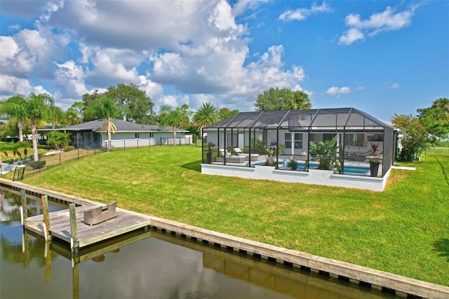 rear view of property with a yard, a water view, glass enclosure, a fenced backyard, and an outdoor pool