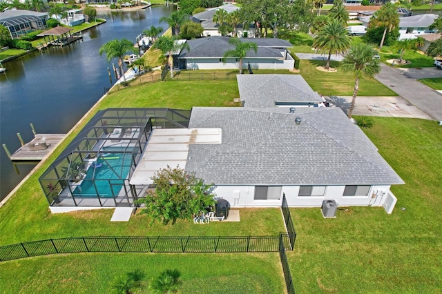 drone / aerial view featuring a residential view and a water view