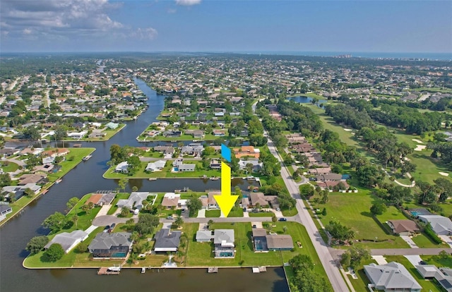 bird's eye view with a water view and a residential view
