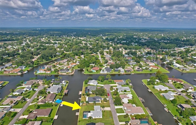 aerial view with a residential view and a water view