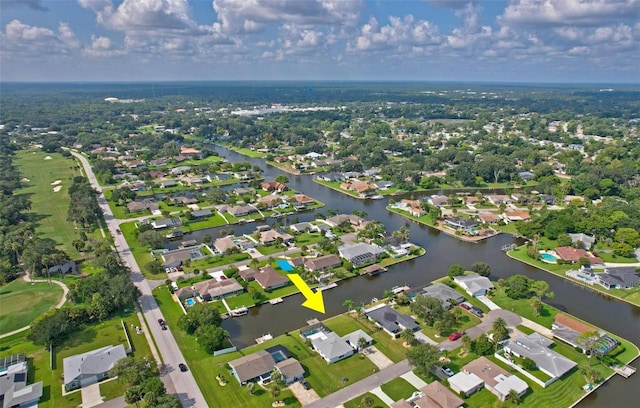 drone / aerial view featuring a water view and a residential view