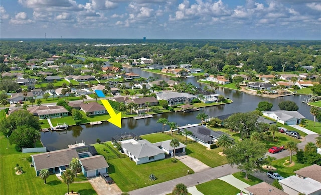 bird's eye view with a water view and a residential view