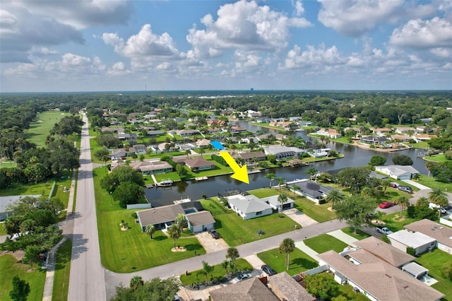 bird's eye view with a residential view and a water view