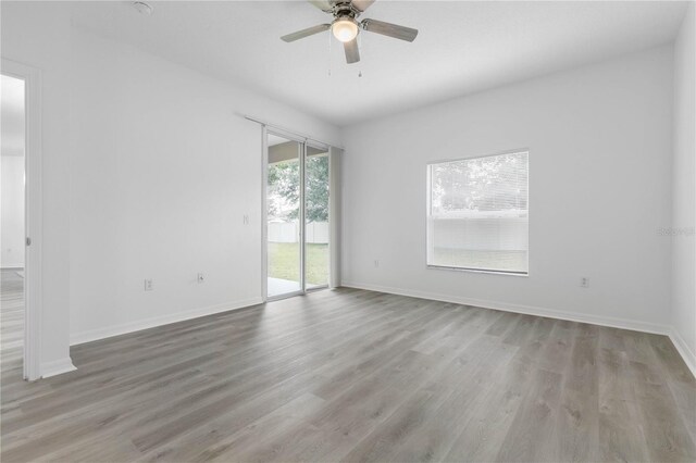 spare room with ceiling fan and hardwood / wood-style floors