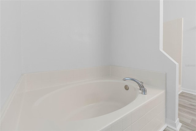 full bath with a garden tub