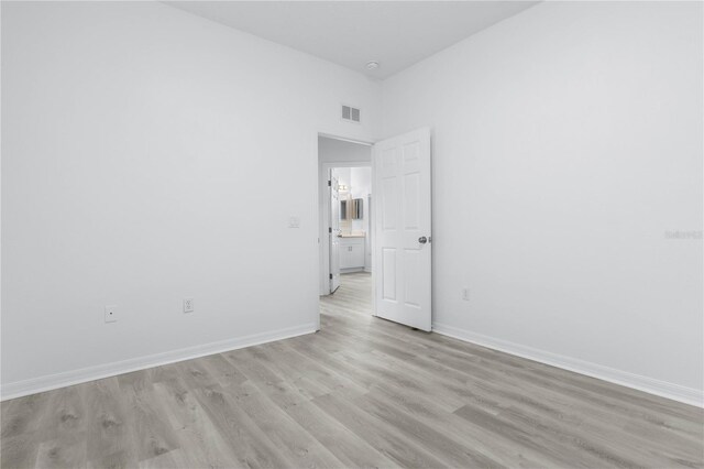 unfurnished room with light hardwood / wood-style floors