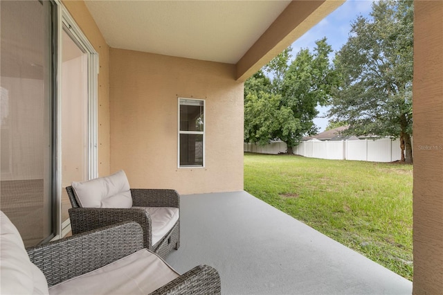 view of patio featuring fence