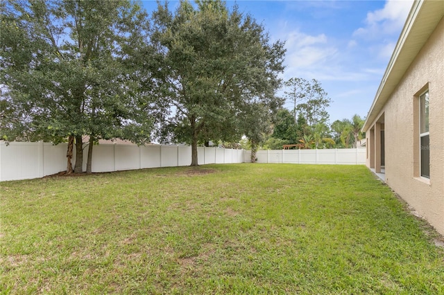 view of yard featuring a fenced backyard