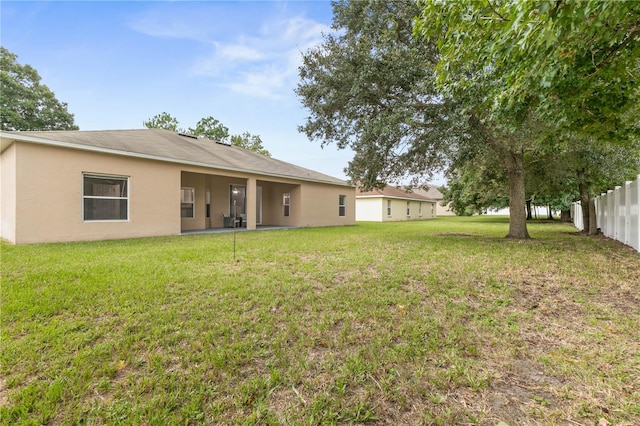 view of yard with a patio area and fence