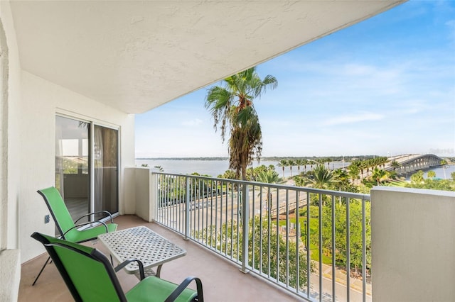 balcony featuring a water view