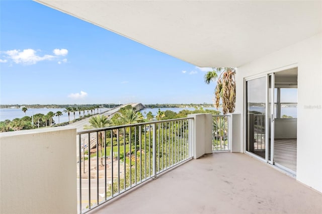 balcony featuring a water view