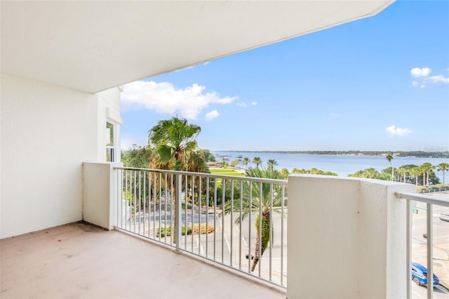 balcony featuring a water view