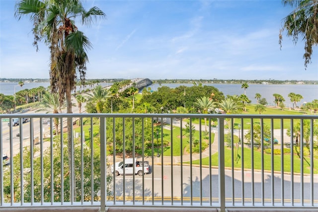 balcony featuring a water view