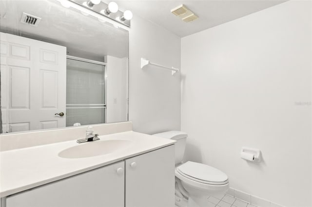 bathroom featuring visible vents, vanity, toilet, and an enclosed shower