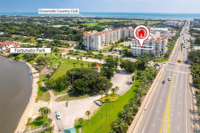 drone / aerial view featuring a water view and a city view