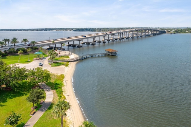 bird's eye view featuring a water view and a pier